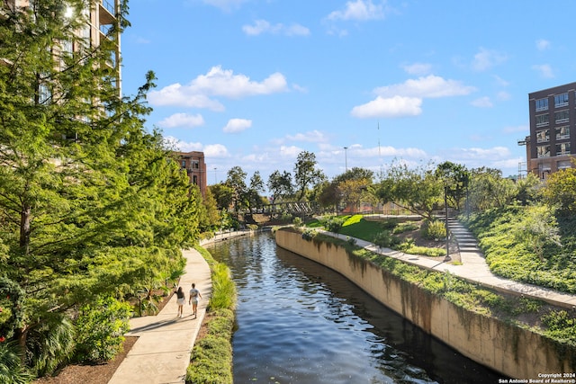 surrounding community featuring a water view