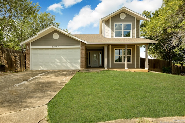 view of front of home featuring a garage and a front lawn