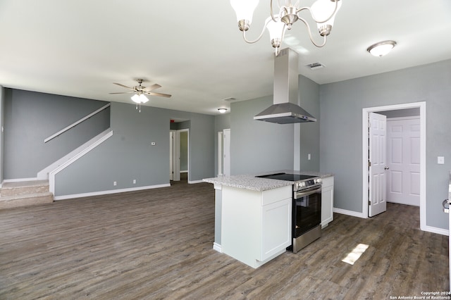 kitchen with white cabinets, stainless steel electric stove, ceiling fan with notable chandelier, dark hardwood / wood-style floors, and extractor fan