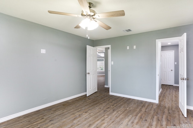 unfurnished bedroom with wood-type flooring and ceiling fan