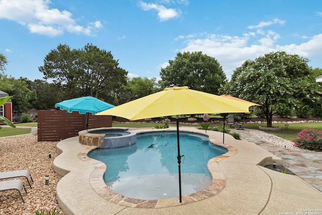 view of pool featuring an in ground hot tub