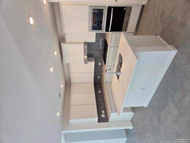 kitchen with white cabinets