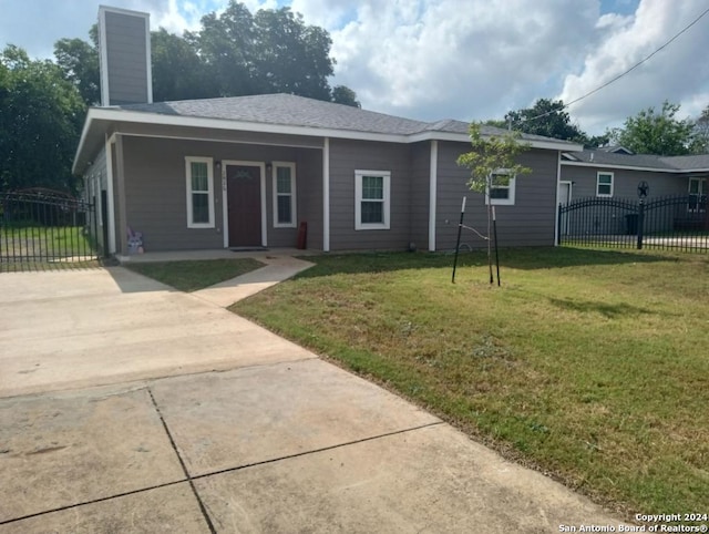 ranch-style home with a front yard