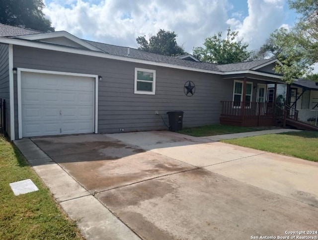 exterior space featuring a garage and covered porch