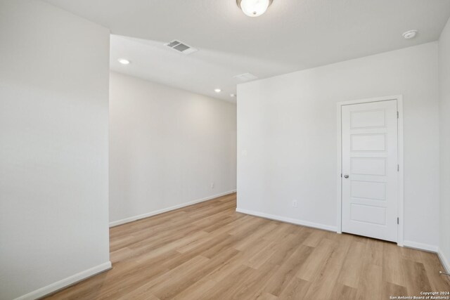 unfurnished room with light hardwood / wood-style flooring