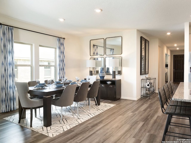 dining space featuring light wood-type flooring