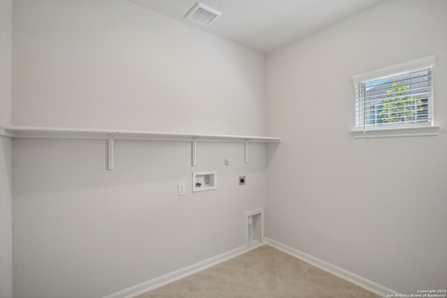 laundry area with electric dryer hookup, gas dryer hookup, and washer hookup