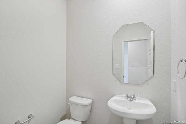 bathroom with sink and toilet