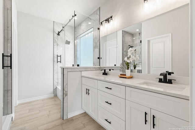 bathroom featuring vanity, hardwood / wood-style flooring, and a shower with shower door