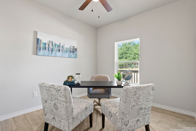 dining space with light hardwood / wood-style flooring and ceiling fan