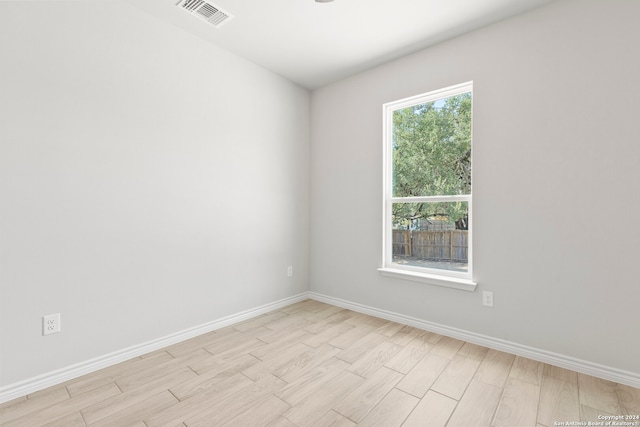 unfurnished room featuring light hardwood / wood-style flooring