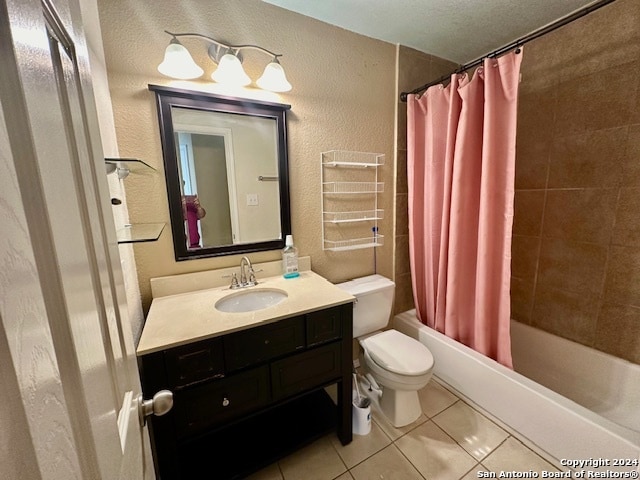 full bathroom with shower / bath combo with shower curtain, vanity, tile patterned floors, and toilet