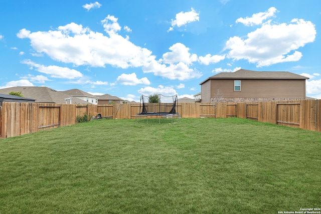 view of yard with a trampoline