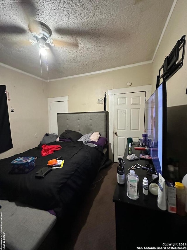 bedroom featuring a textured ceiling, ceiling fan, and crown molding