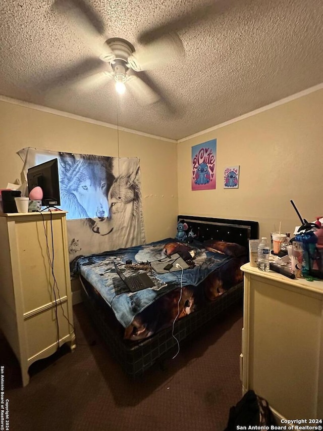 bedroom featuring dark carpet, a textured ceiling, and crown molding