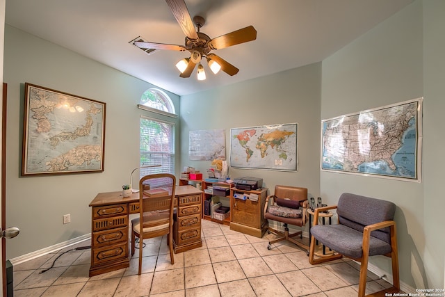 tiled office space featuring ceiling fan