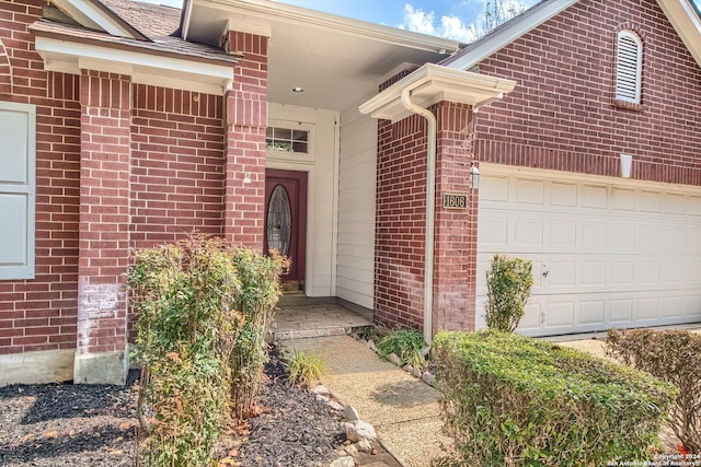 property entrance with a garage