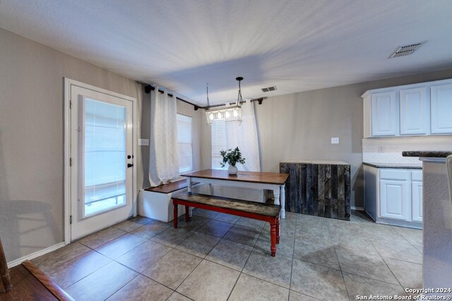 dining space with light tile patterned floors