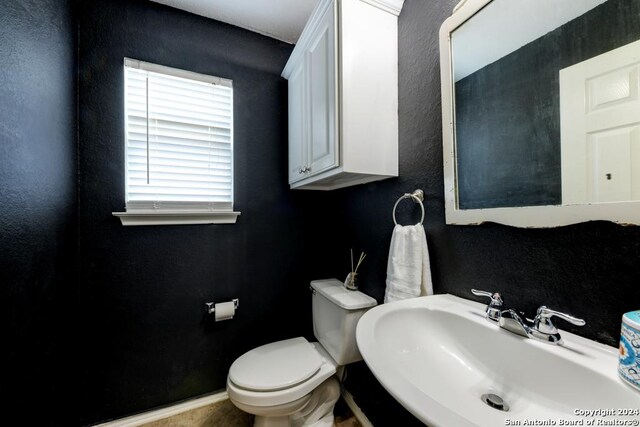 bathroom with sink and toilet