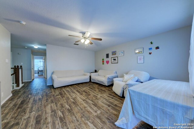 bedroom featuring ceiling fan and hardwood / wood-style flooring