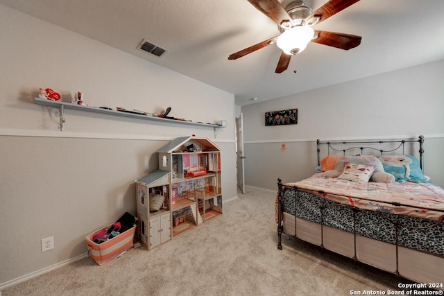 bedroom featuring light colored carpet and ceiling fan