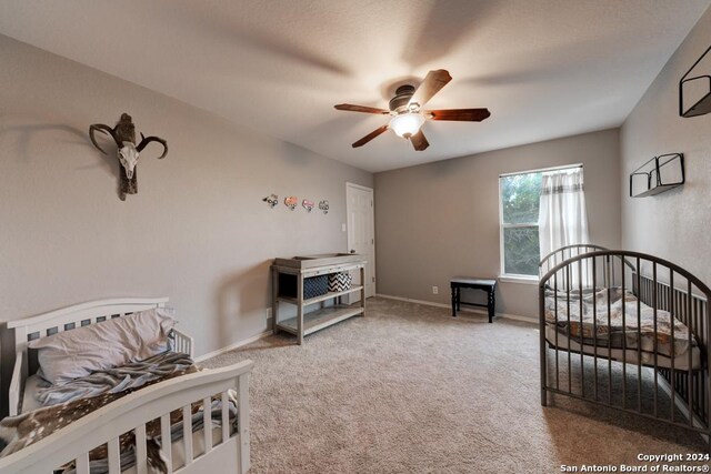 carpeted bedroom featuring ceiling fan