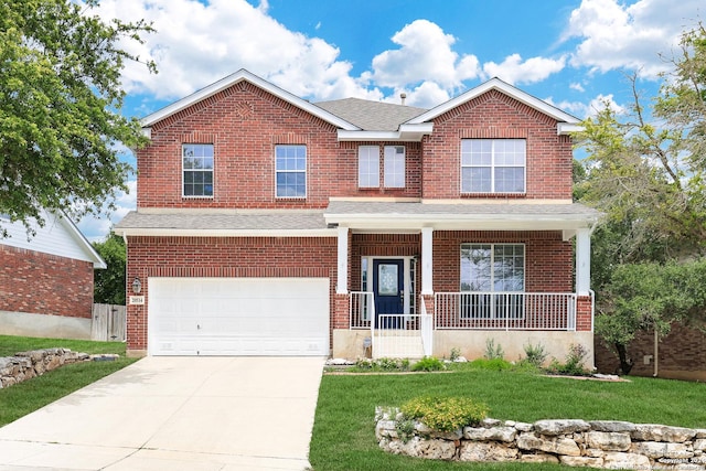 craftsman-style house with a garage, covered porch, and a front lawn