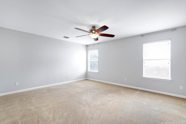 unfurnished room with carpet floors and ceiling fan