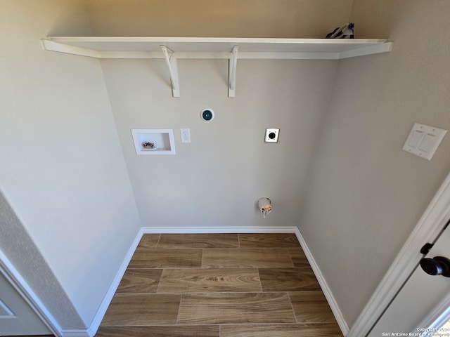 washroom featuring hookup for a washing machine, hookup for an electric dryer, gas dryer hookup, and hardwood / wood-style floors