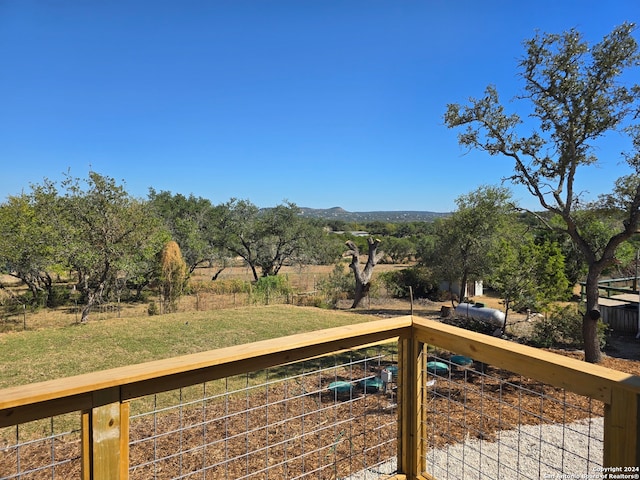 wooden terrace with a rural view