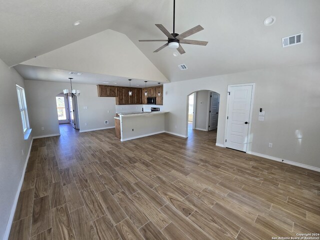 miscellaneous room featuring vaulted ceiling and plenty of natural light