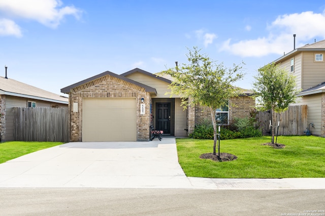 view of front facade with a garage and a front lawn