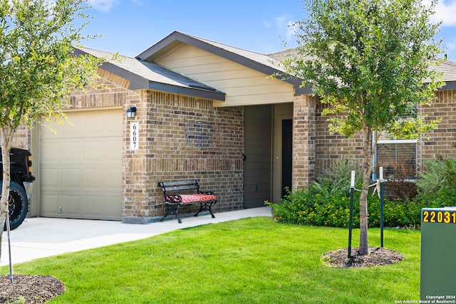 ranch-style home featuring a garage and a front lawn