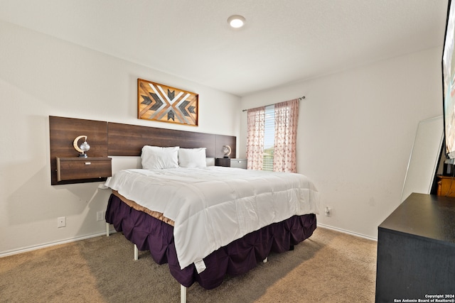 bedroom featuring light colored carpet