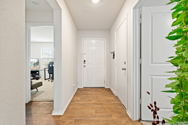 hallway featuring light wood-type flooring