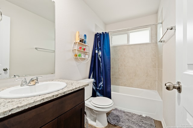 full bathroom with vanity, toilet, and shower / tub combo