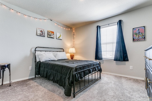 carpeted bedroom with a textured ceiling