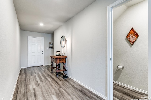 hall with light hardwood / wood-style flooring