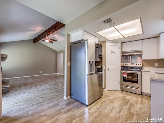 kitchen with white cabinets, ceiling fan, stainless steel appliances, light hardwood / wood-style floors, and lofted ceiling with beams