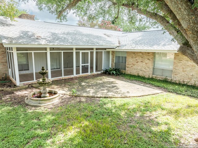 ranch-style house with a front lawn