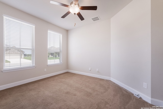 unfurnished room featuring carpet floors and ceiling fan