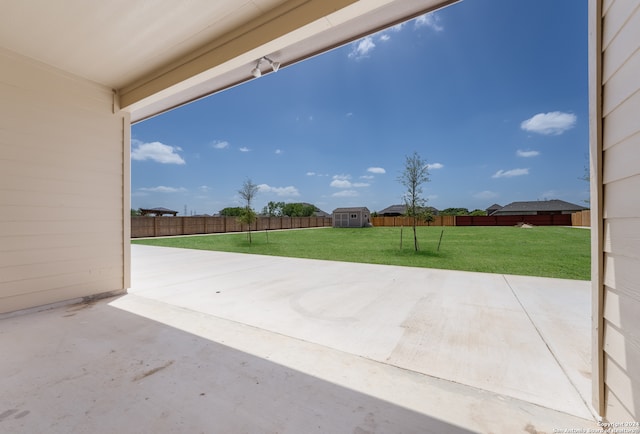 view of patio with a storage shed