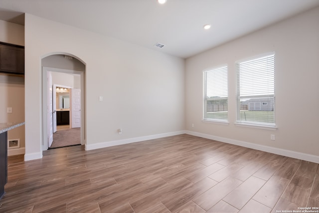 spare room with hardwood / wood-style flooring