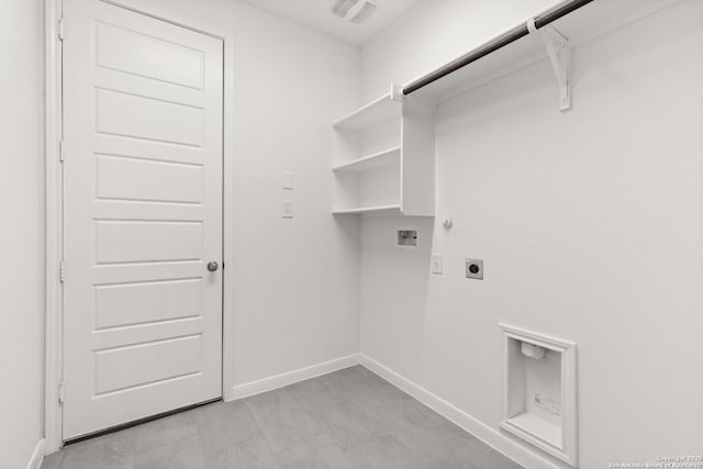 clothes washing area with gas dryer hookup, hookup for a washing machine, hookup for an electric dryer, laundry area, and baseboards