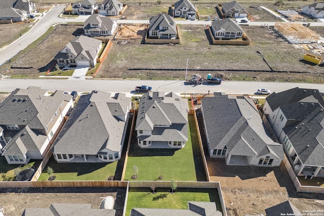 birds eye view of property with a residential view