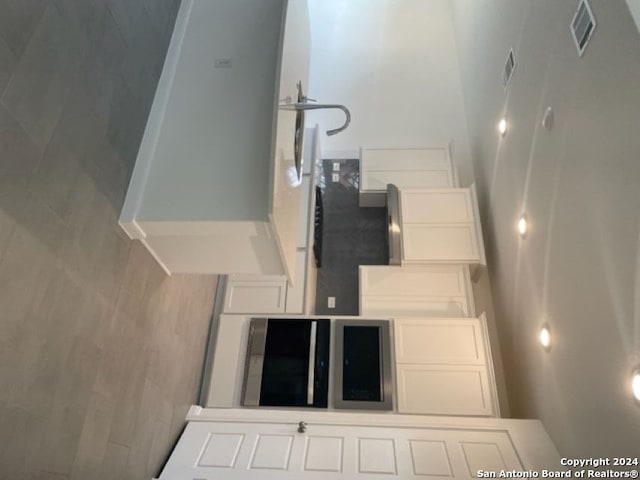 kitchen featuring white cabinets