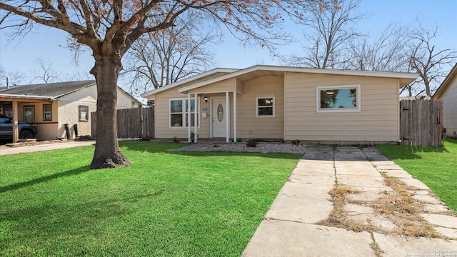 bungalow-style home featuring a front lawn