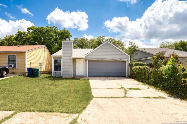 ranch-style home with a garage and a front lawn