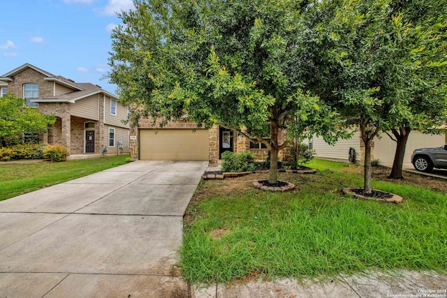 view of front of property with a garage and a front yard