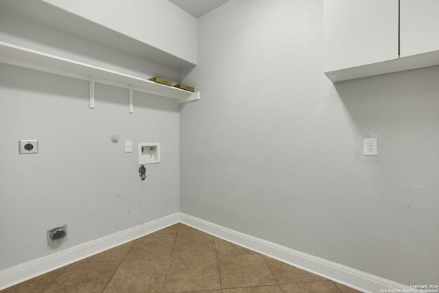 laundry area featuring gas dryer hookup, washer hookup, tile patterned flooring, and electric dryer hookup